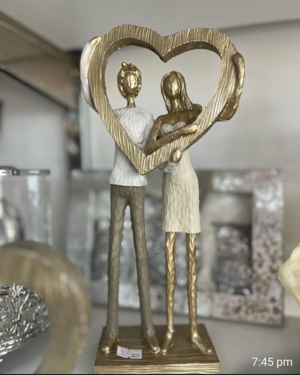 Couple Holding Heart Statue