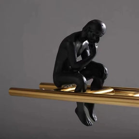 See-Saw Thinking Man Sculptures